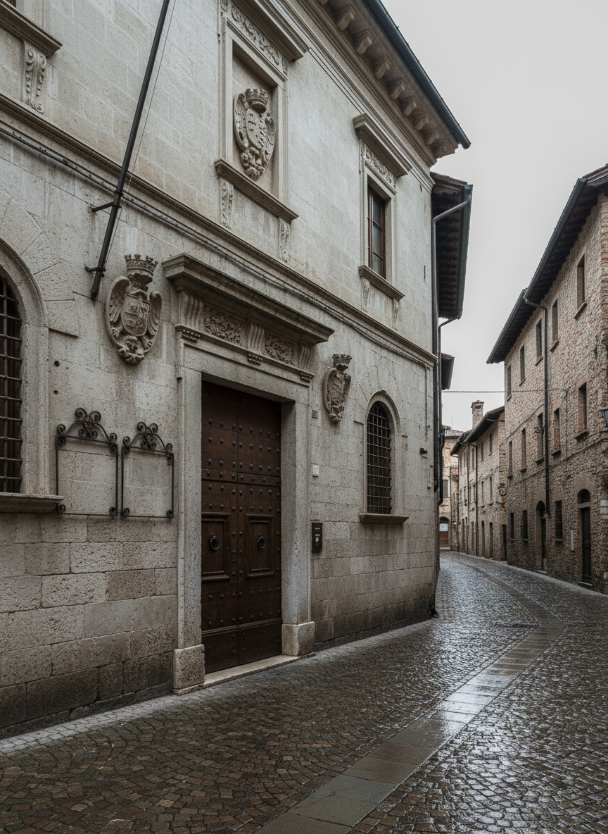 A meticulously detailed stone municipal building standing in a narrow street of an old Italian town near Verona, its façade displaying ornate cornices, carved coats of arms, and a heavy wooden door with iron studs. Beside the entrance, empty wrought-iron notice boards and a simple flagpole suggest civic life without showing people. The cobblestone pavement glistens slightly as if after a light rain. Diffused overcast light creates soft, even illumination, revealing subtle textures in the stone and wood while casting gentle, moody shadows in the recessed doorway. Captured at eye level with a slight angle along the street, the photographic realism and muted color palette evoke a professional, archival atmosphere tinged with quiet intrigue.